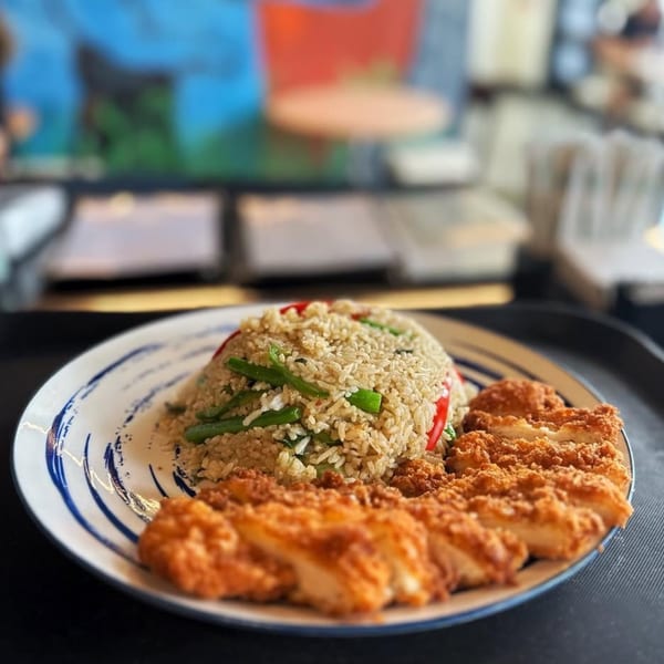 Sala Thai's fried rice with green beans and red peppers, served with crispy fried chicken.
