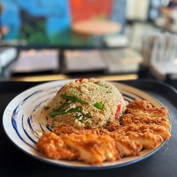 Sala Thai's fried rice with green beans and red peppers, served with crispy fried chicken.