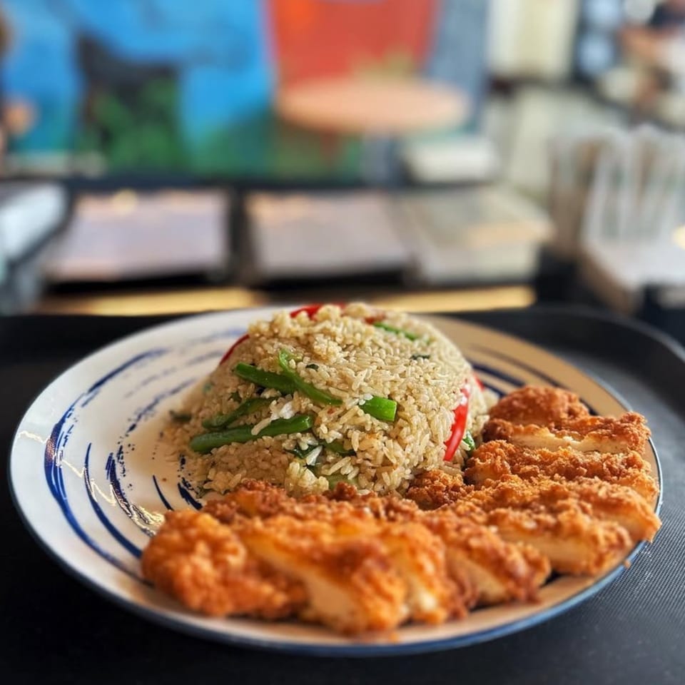 Sala Thai's fried rice with green beans and red peppers, served with crispy fried chicken.