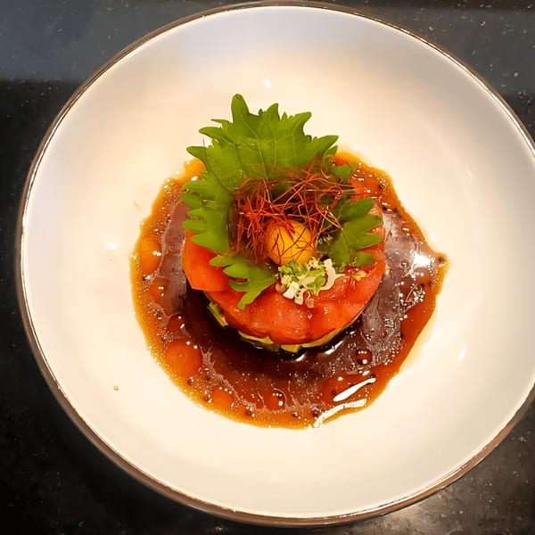 Sala Thai's tuna tartare with avocado, shiso leaf, chili threads, and a quail egg yolk.