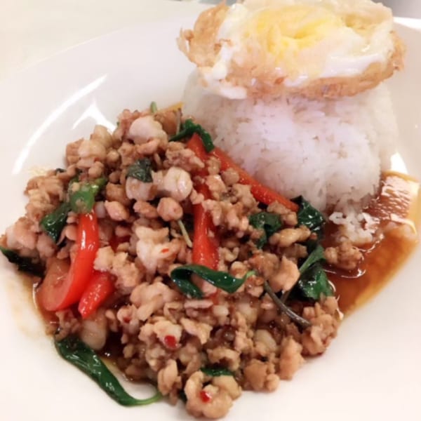 Sala Thai's Pad Krapow with minced chicken, basil, chili, and a fried egg over rice.