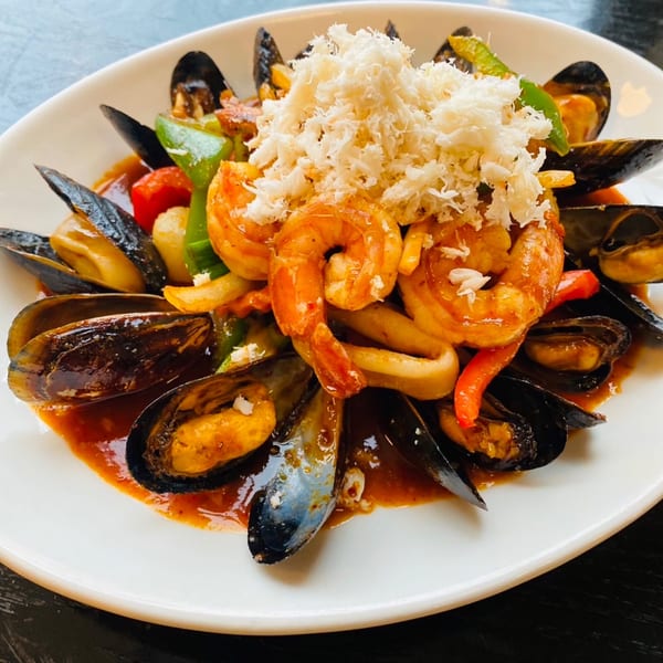 Sala Thai's seafood dish with mussels, shrimp, squid, bell peppers, and crab meat.