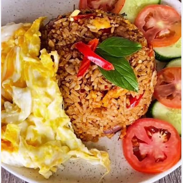Sala Thai's fried rice with scrambled egg, red chilies, basil, sliced tomatoes, and cucumbers.