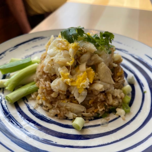 Sala Thai's crab fried rice, topped with scrambled egg, cilantro, and green onions.
