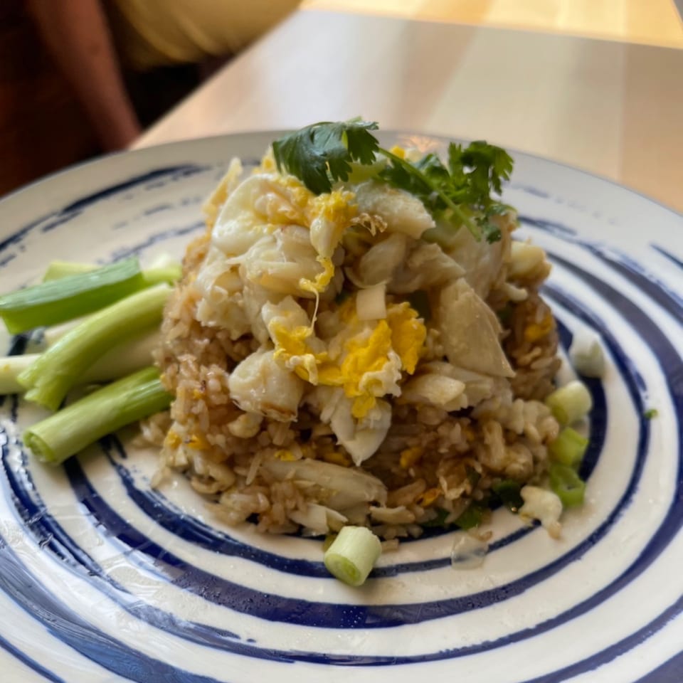 Sala Thai's crab fried rice, topped with scrambled egg, cilantro, and green onions.