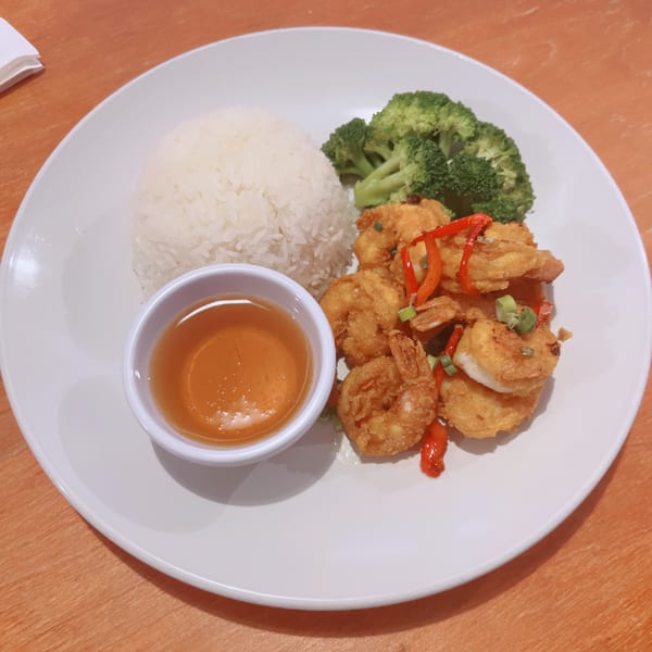Sala Thai's crispy shrimp with rice, broccoli, and a side of sweet chili sauce.