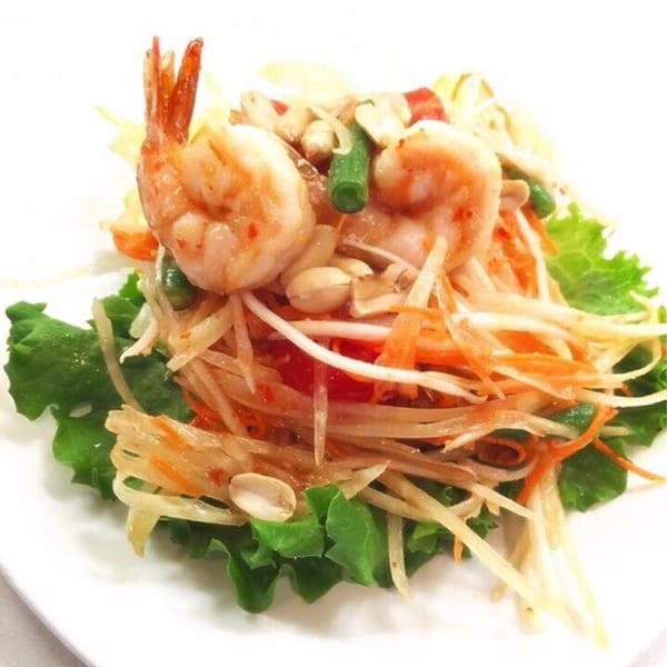 Sala Thai's papaya salad with shrimp, peanuts, and green beans on a bed of lettuce.